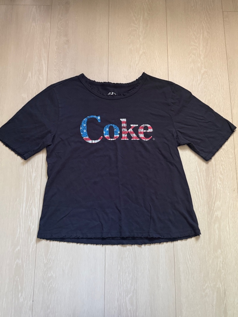 Recycled Karma Black Tee with Red & Blue 'Coke' Logo
